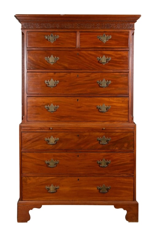 20TH C. GEORGIAN STYLE CHERRY DRESSER: 20th century Georgian style cherry dresser with carved detail to crown, brass pulls, eight drawers. Approximate dimensions: h. 74", w. 42.5", d. 21.75" Disclaimer: Participating bidders must have a