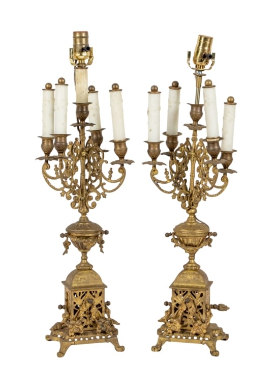 PAIR OF CONVERTED BOUILLOTTE TABLE LAMPS: Pair of converted brass bouillotte table lamps with claw feet and urn accent to posts. Approximate dimensions: h. 26", w. 6.5", d. 6.5" Disclaimer: Participating bidders must have a credit card on