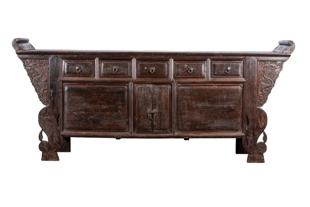 19TH C. CHINESE ALTAR CABINET: 19th century Chinese altar cabinet with incised carved dragon motif on each wing, five pull out drawers each with ring pulls, and large cabinet doors with hasp and pin lock set. Approximate