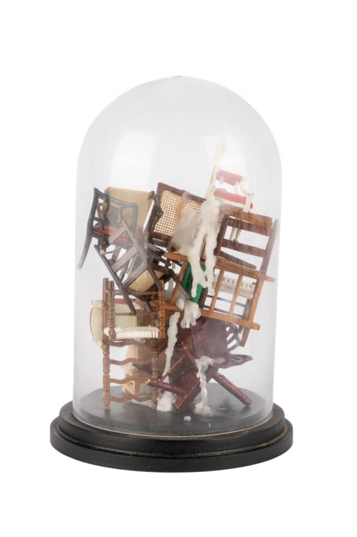 STACKED CHAIR ART SCULPTURE IN CLOCHE: Stacked chair art sculpture in cloche. Miniature chairs stacked in an art form, unsigned. Approximate dimensions: h. 10.5", w. 7", d. 7" Disclaimer: Participating bidders must have a credit card on