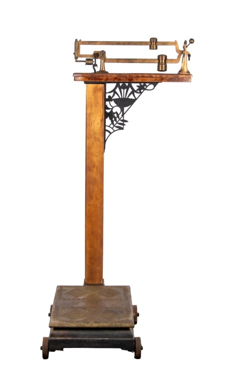 ANTIQUE BRASS & OAK DOCTOR’S SCALE: Antique brass and oak doctor’s scale. Approximate dimensions: h. 58.5", w. 28", d. 33" Disclaimer: Participating bidders must have a credit card on file with LiveAuctioneers in order for their