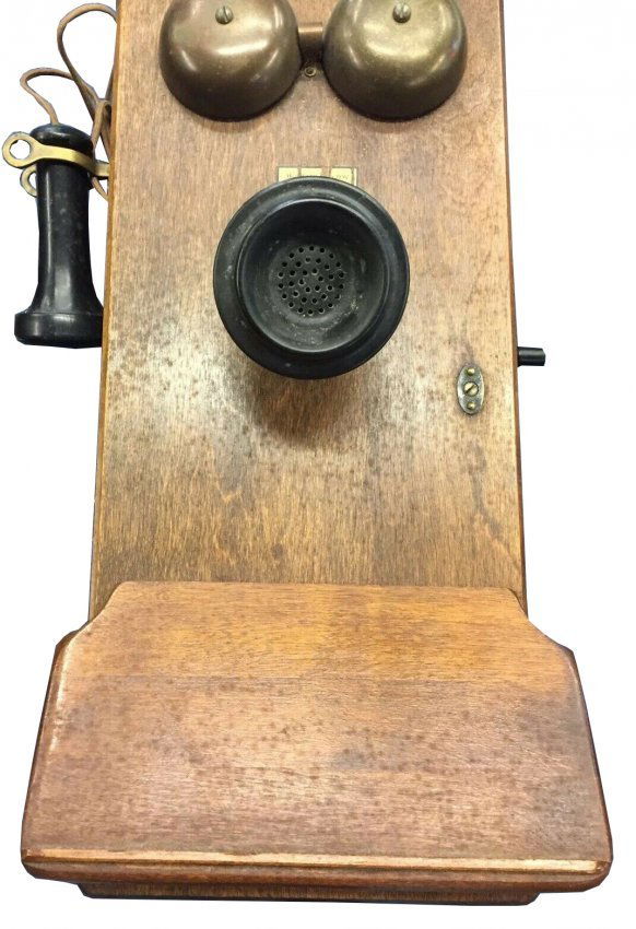 country store oak cased General Electric wall phone: This phone is rare and all original and working! I believe Ericsson is a Swedish company and had their phones made in the US due to the English directions inside door. approx. size of box 10"h x 8 1/2