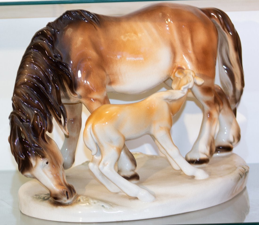 Royal Dux porcelain of Mare and foal: This is a large size porcelain glazed statue of a mare and nursing foal. The base is signed Royal Dux and Royal Dux Bohemia in pink triangle stamp and number 478 57. approx. 12"h x 16"w x 9 1/2"d