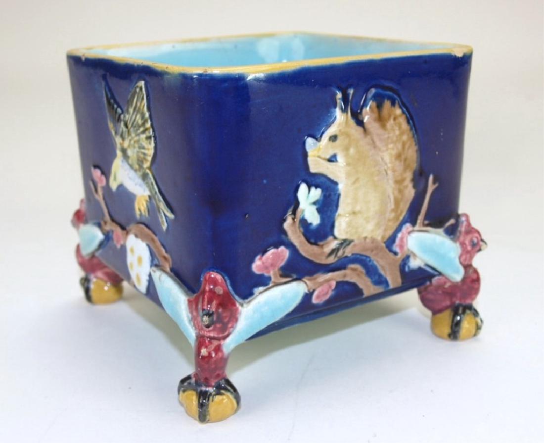 Holdcraft Majoica aquare squirrel & bird planter with: Holdcraft Majoica aquare squirrel & bird planter with bird corners & ball feet, 4" w 4" h, rim nick, hairline with bird corners & ball feet, 4" w 4" h, rim nick, hairline