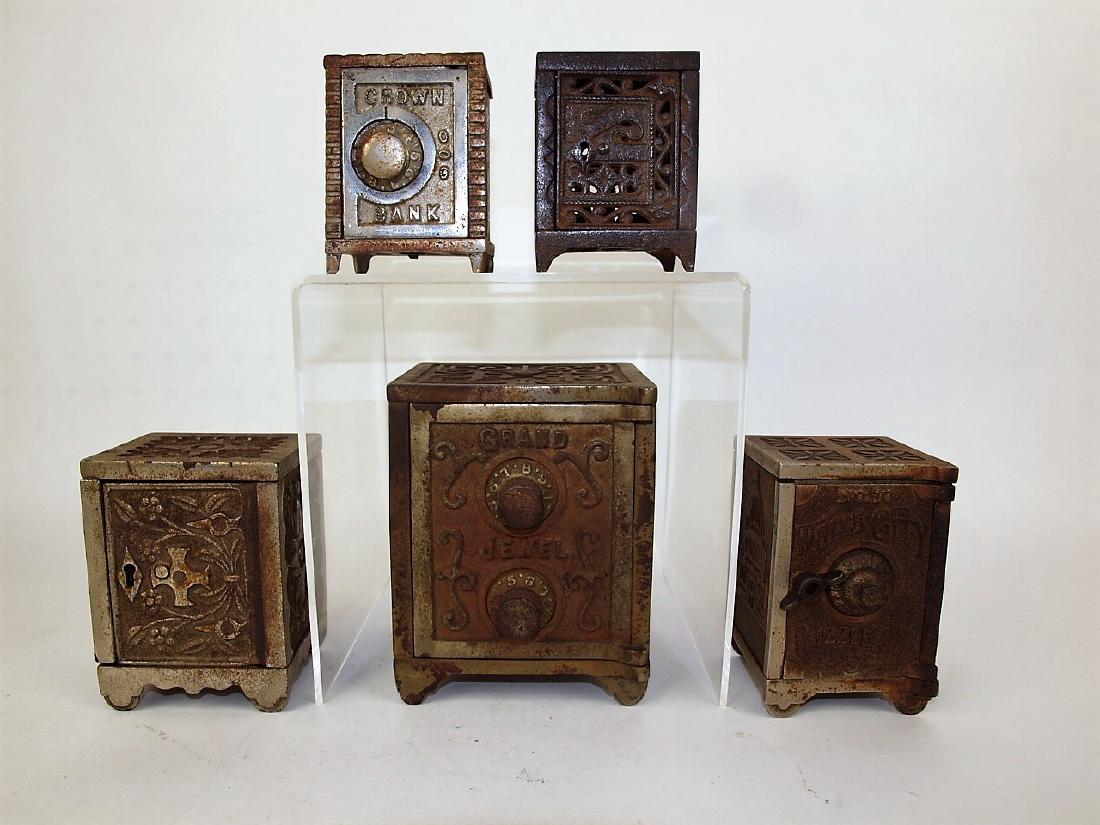Cast iron lot of 5 safe banks, 3 1/4" to 5 1/4", "Grand (1 of 1)