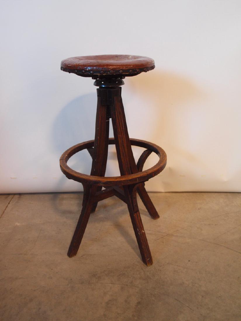 Machine age industrial drafting stool with wood base (1 of 1)