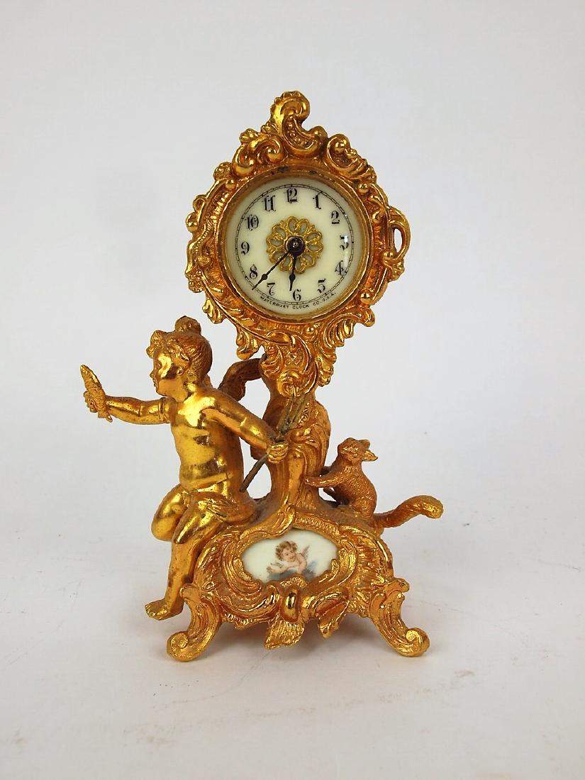 Waterbury figural clock wtih cherub and squirrel one of: Waterbury figural clock wtih cherub and squirrel one of the cherub wings re-stuck
