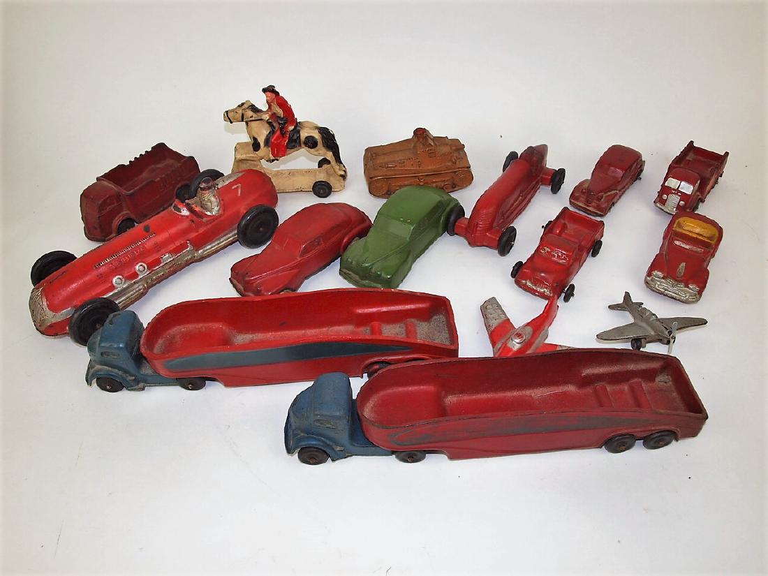 Auburn Rubber Co lot of 15 cars, trucks, airplanes, and: Auburn Rubber Co lot of 15 cars, trucks, airplanes, and cowboy on horse