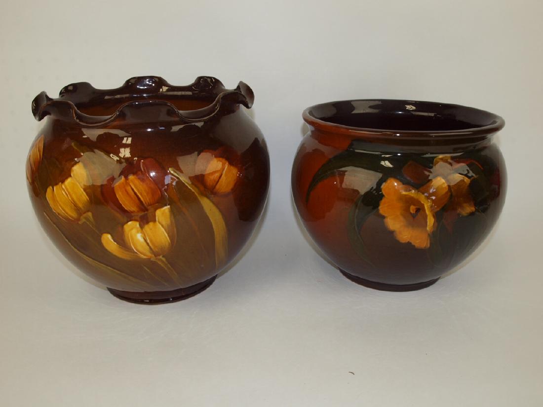 Lot of 2 art pottery brown standard glaze jardinieres:: Lot of 2 art pottery brown standard glaze jardinieres: 9 1/2" tulip (rim nick), and 8" daffodiljardinieres: 9 1/2" tulip (rim nick), and 8" daffodil