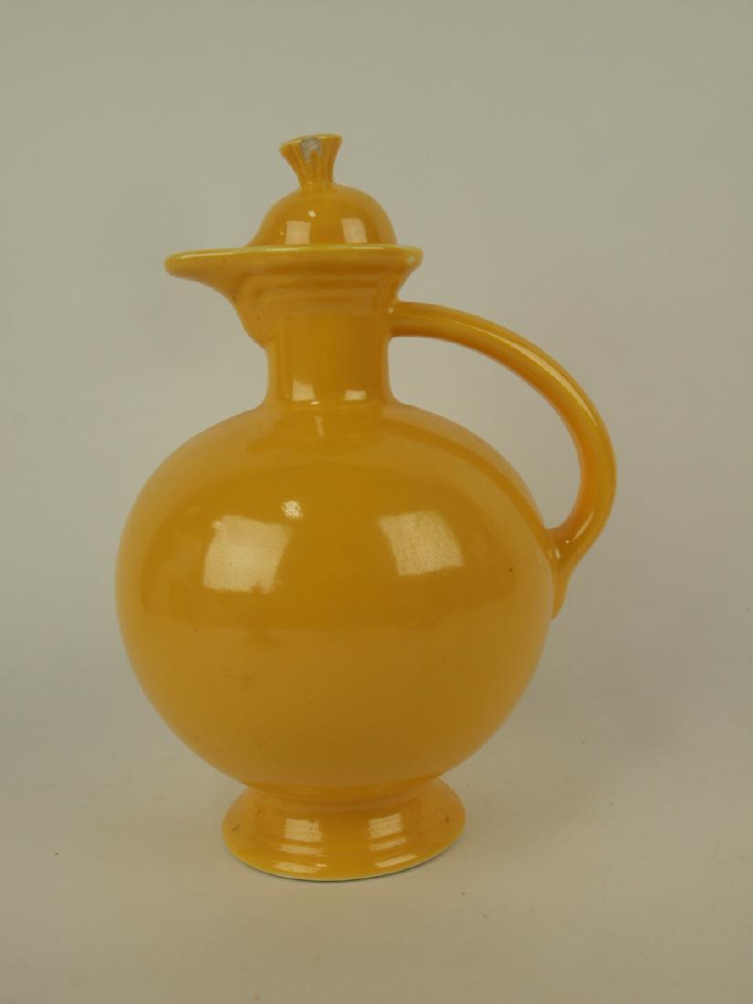 Fiesta water carafe, yellow, chip to finial (1 of 1)