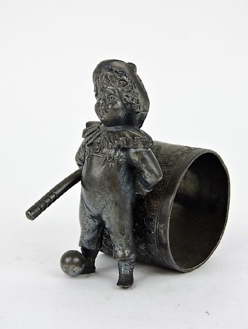 Silver plate figural napkin ring of girl with baseball (1 of 1)