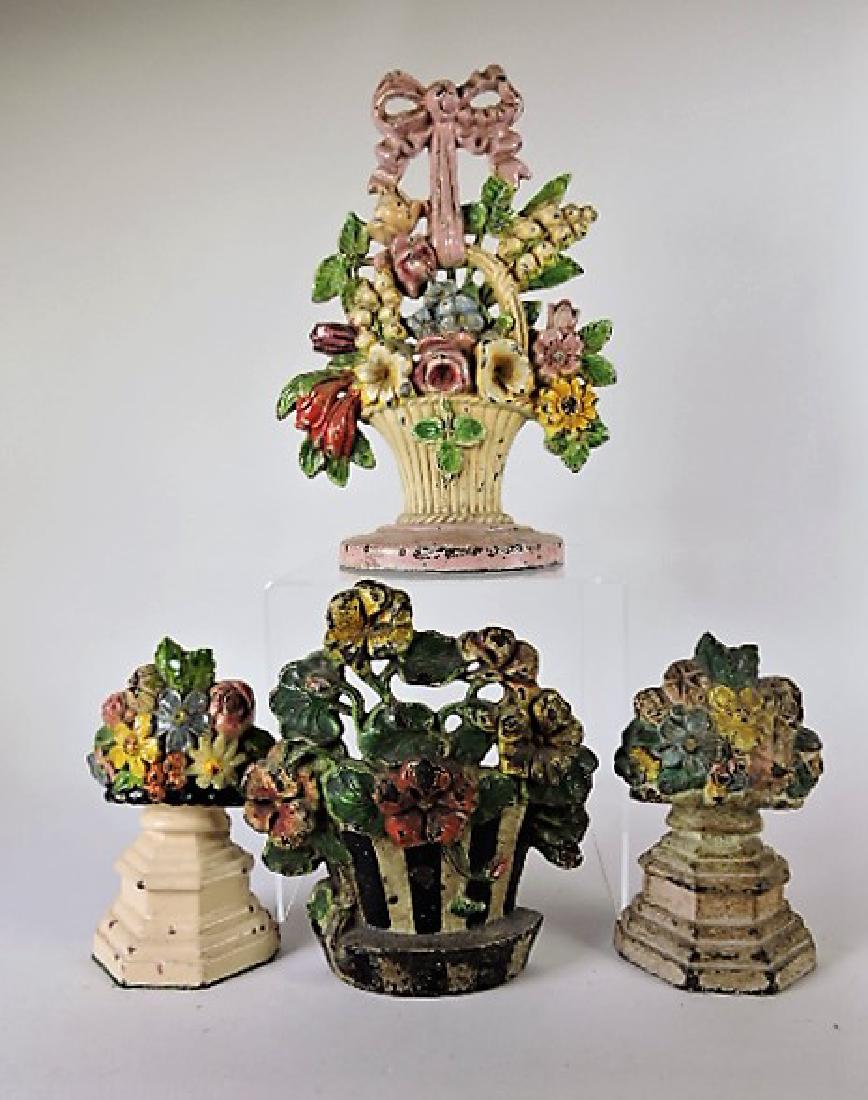 Cast iron lot of 4 flower doorstops: .