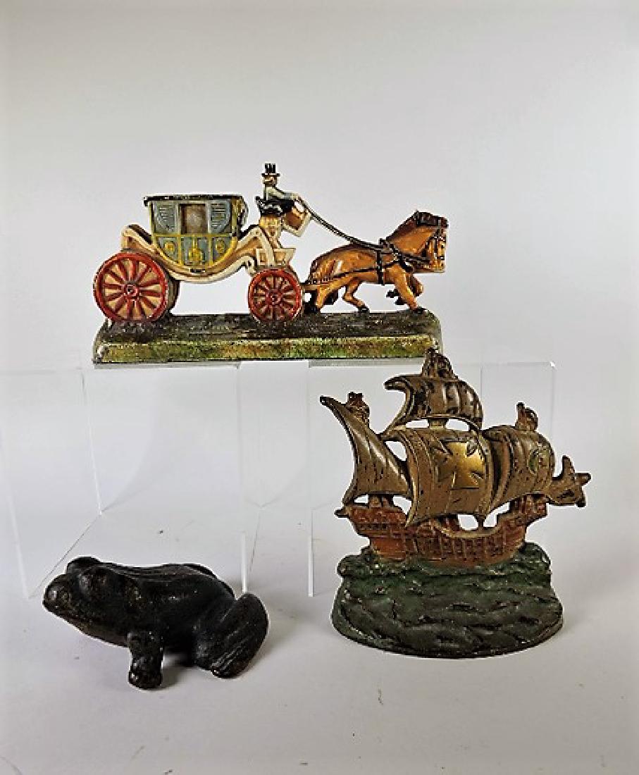 Cast iron lot of 3 doorstops - carriage, frog, and ship: ship