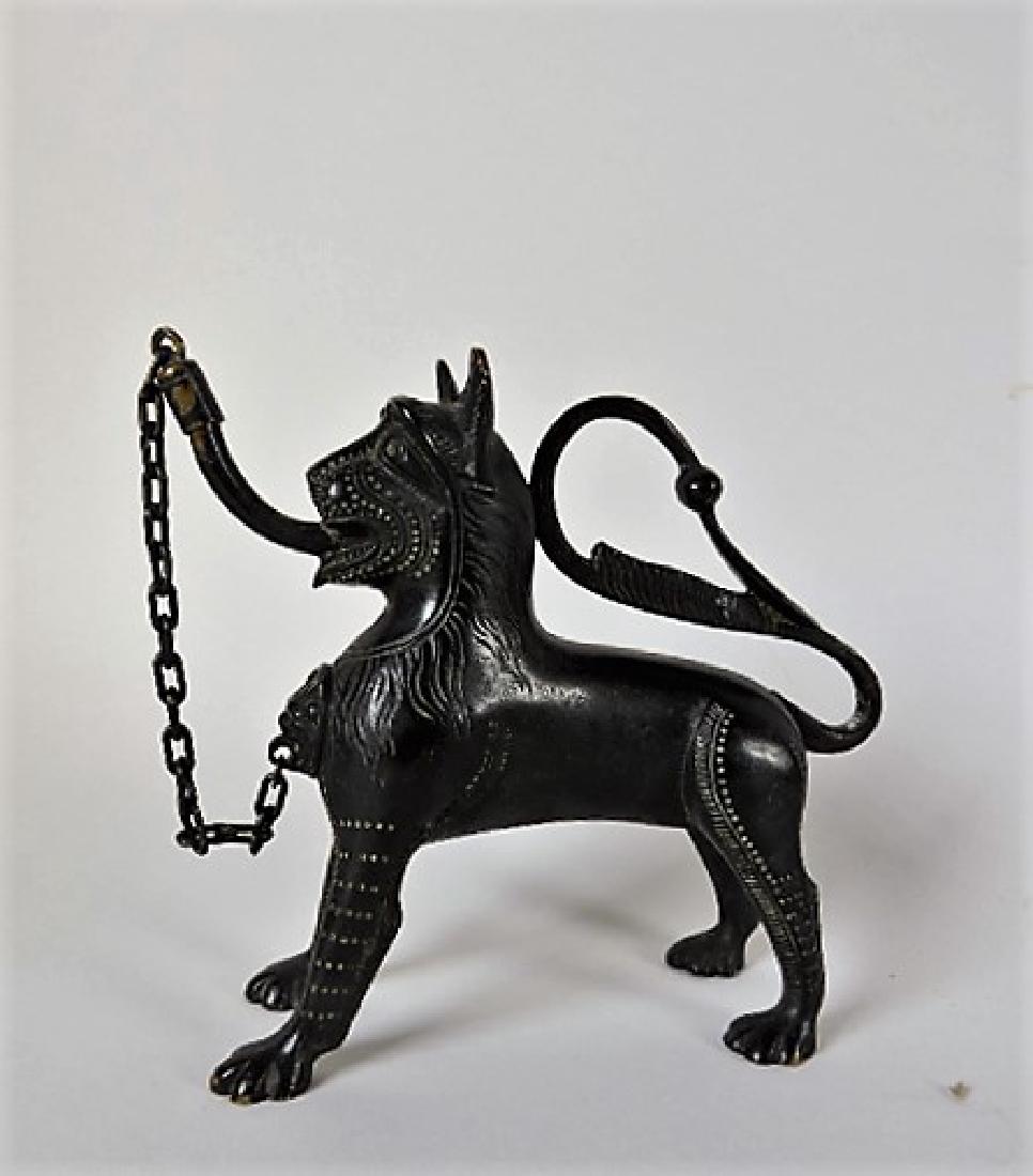 Early bronze aquamanile in the form of an Egyptian: lion, 5"
