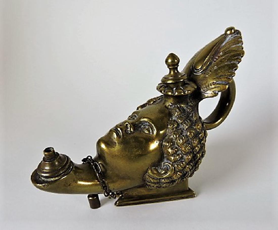 Early bronze aquamanile in the form of an Egpytian: lady, 3 1/2"h, 5"l