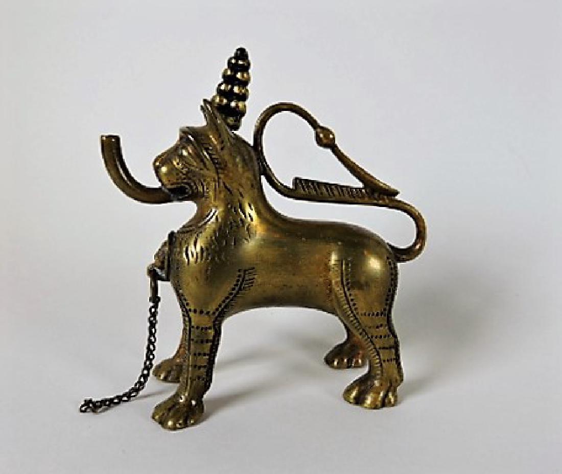 Early bronze aquamanile in the form of an Egyptian: lion, 3 1/2", marked on botton of one paw