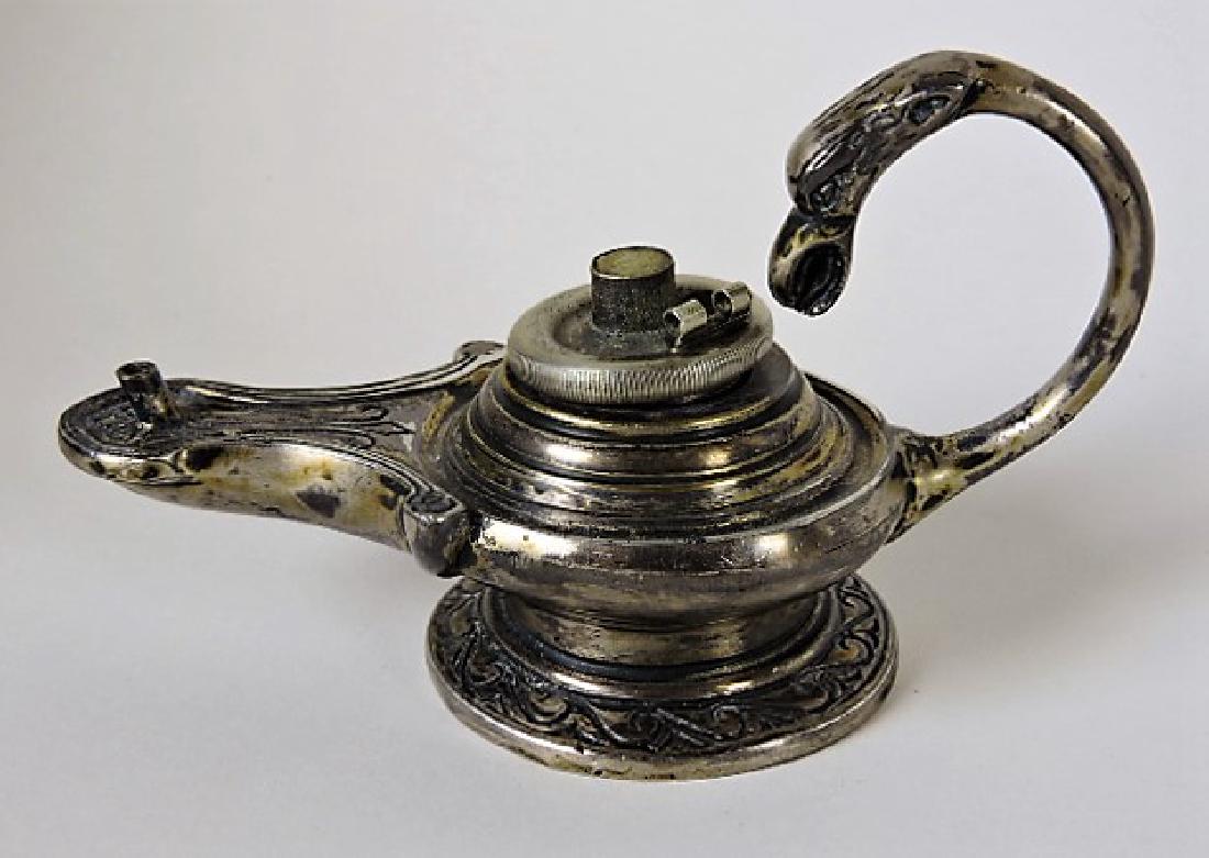 Early silver aquamanile with bird head handle: . burner appears to be not original to the piece