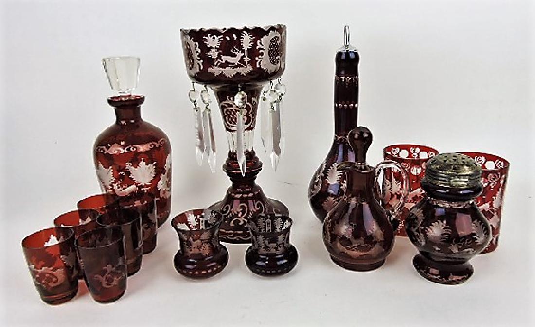 Ruby flash with stag lot of 15 pcs - wine decanter: (chip), 6 wine glasses, candle luster, 2 toothpick holders, barber bottle, 2 tumblers, cruet, and muffineer