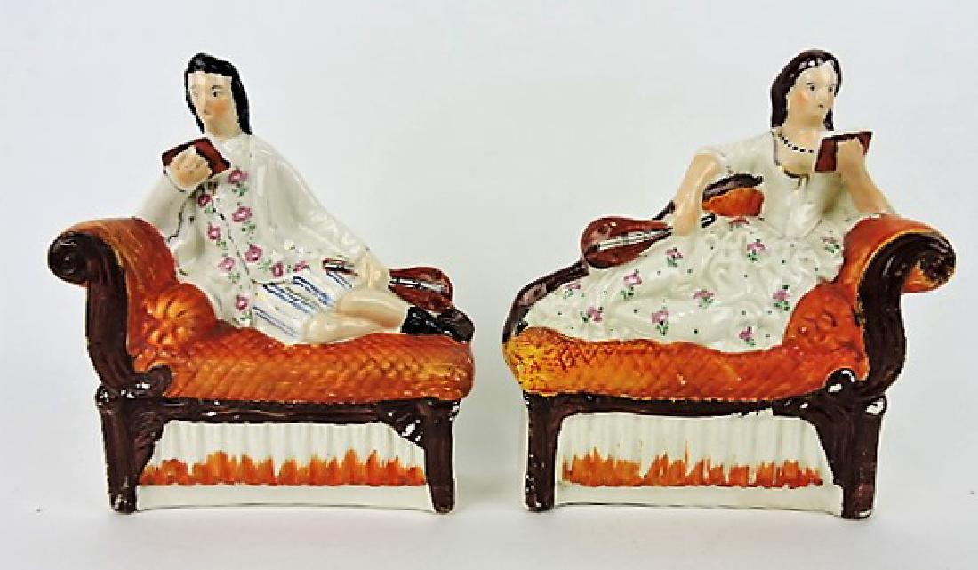 Staffordshire pair of figures of man and woman: reclining on recamiers, 8 1/2"