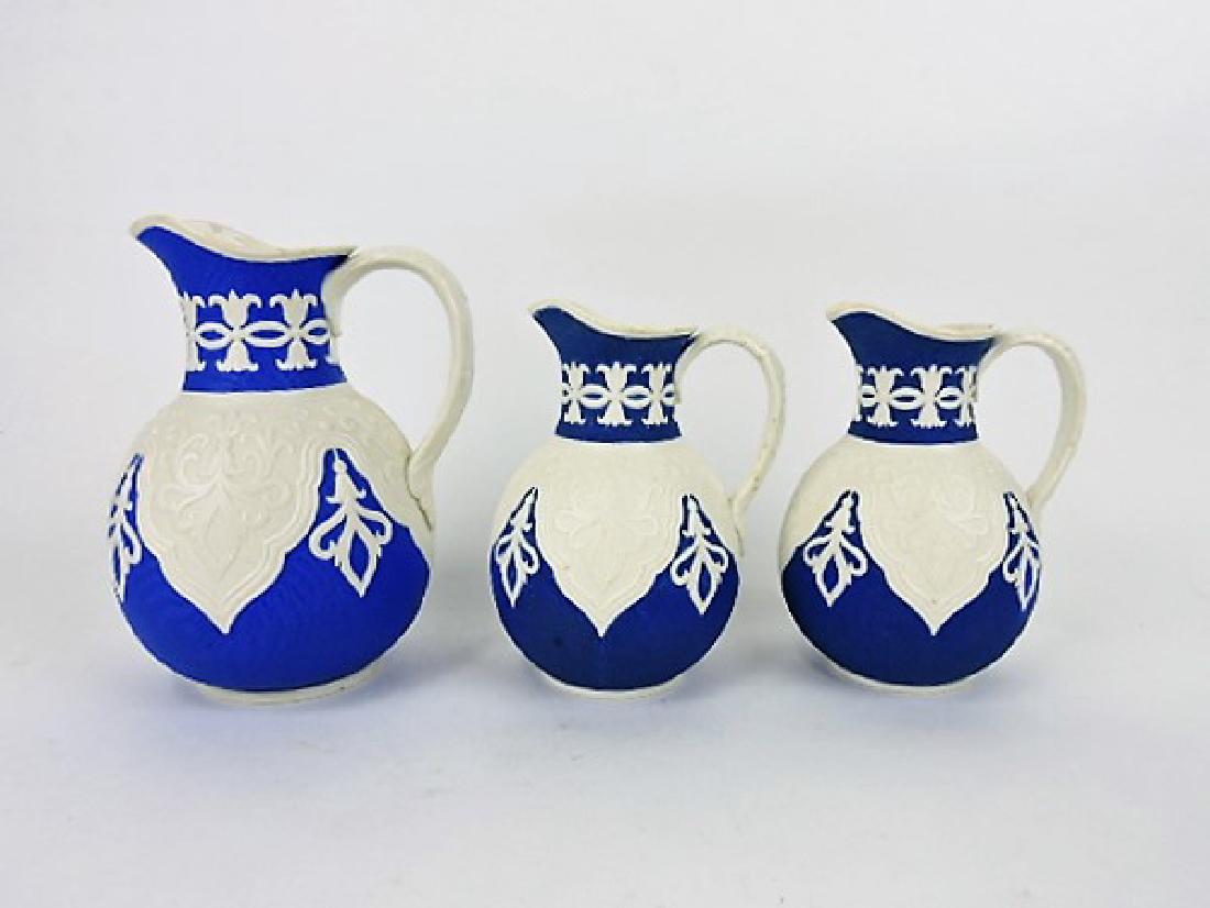 Brownfield lot of 3 parian on blue reverse: pitchers: 1 - 7 1/2", 2 - 6" (both with rim nicks)