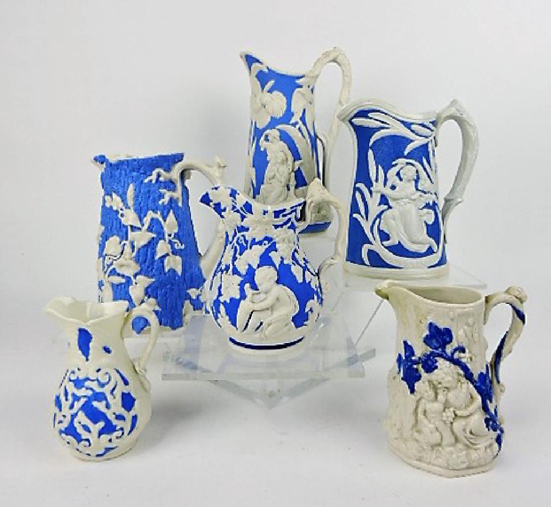 Lot of 6 blue and white parian jugs 4" to 8": .