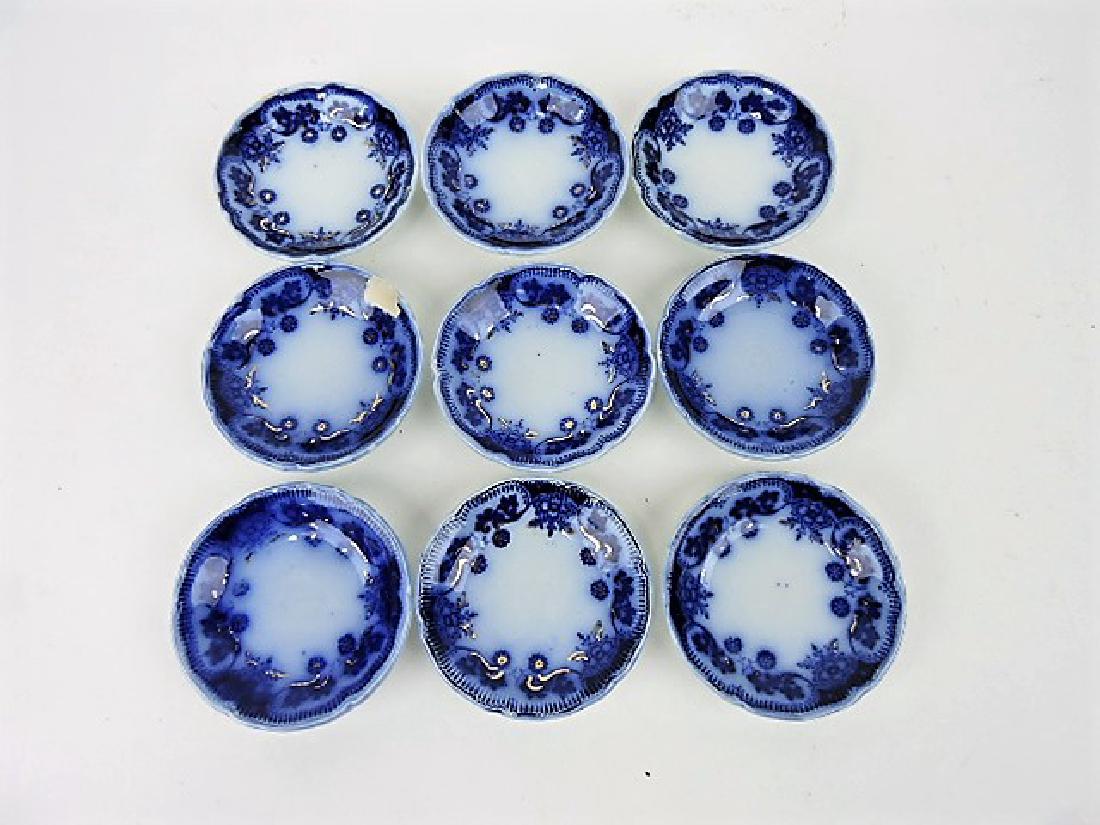 Flow Blue set of 9 butter pats, chip to one (1 of 1)