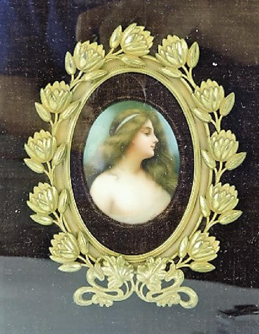 Hutchenruther porcelain portrait plaque signed: Wagner, 3 1/2", in brass floral frame inside wood frame