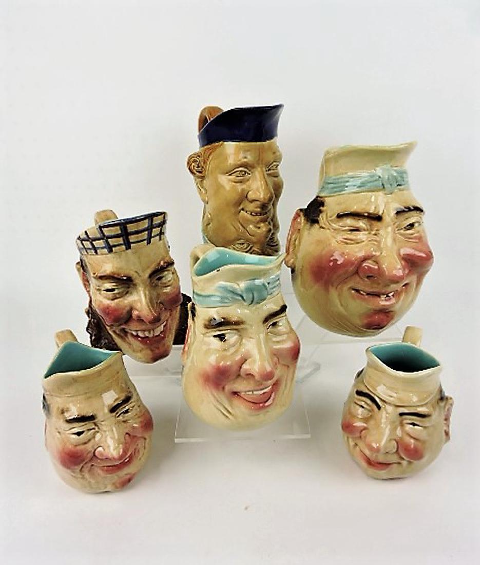 Sarreguemines majolica lot of 4 face jugs, various: condition