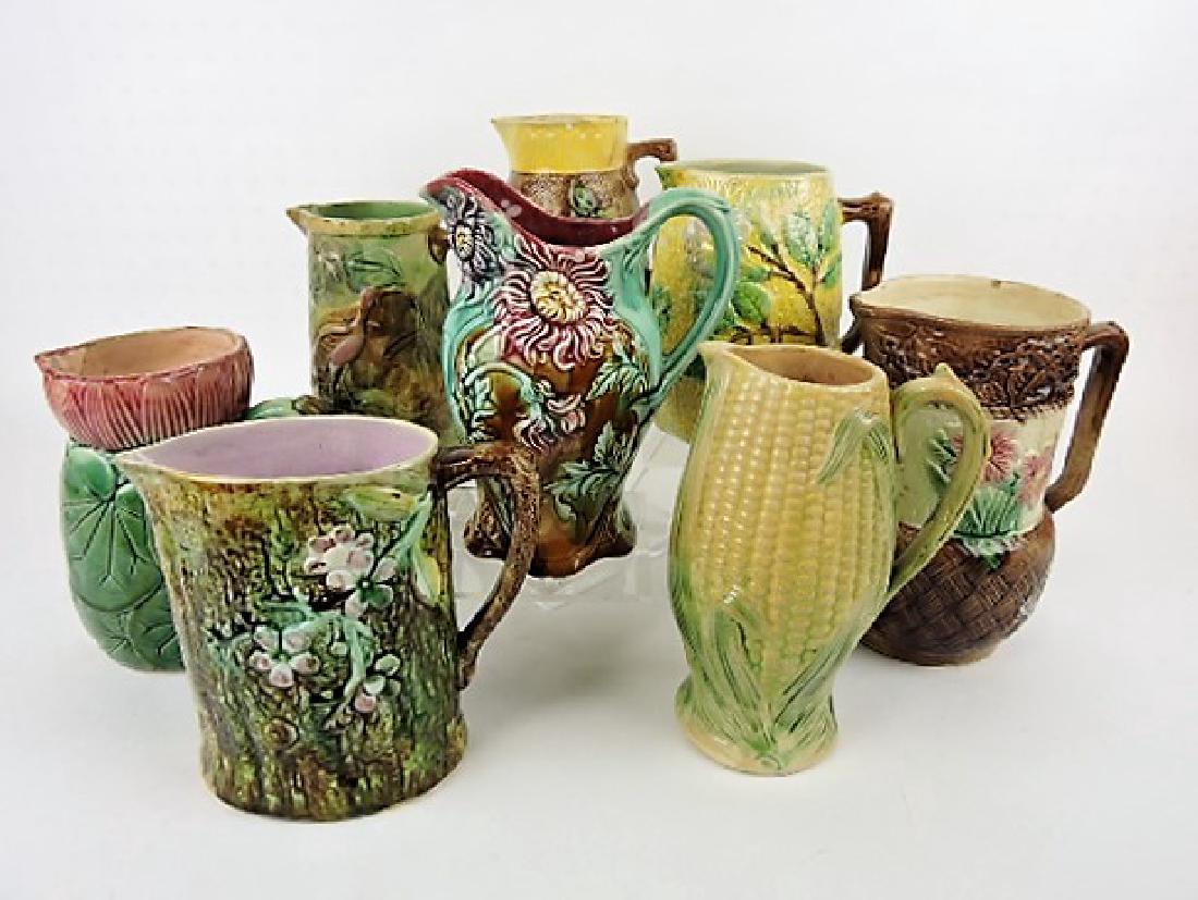 Majolica lot of 8 pitchers various condition: .