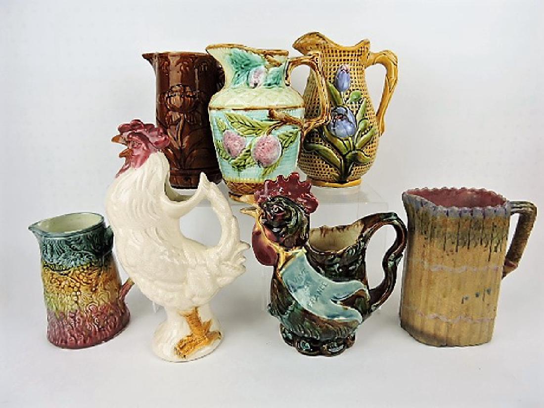 Majolica lot of 7 pitchers, various condition: .
