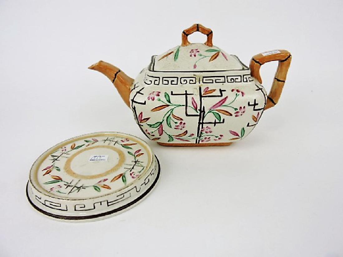 Brownhills Pottery majolica teapot and trivet: .