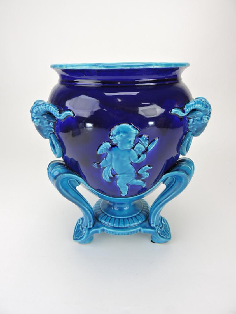 Minton majolica French blue and cobalt jardiniere: with cherubs and ram heads, 12", professional rim repair to legs
