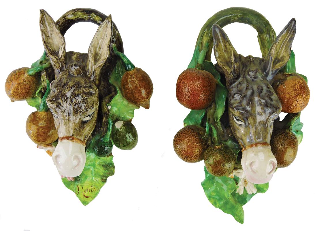 Rare Pair of Menton Majolica Donkey Wall Appliques: c.1890, each modeled as the head of a donkey against a green leaf backplate with applied oranges with branch hanging hooks, 9" Curated and catalogued by Nicolaus Boston