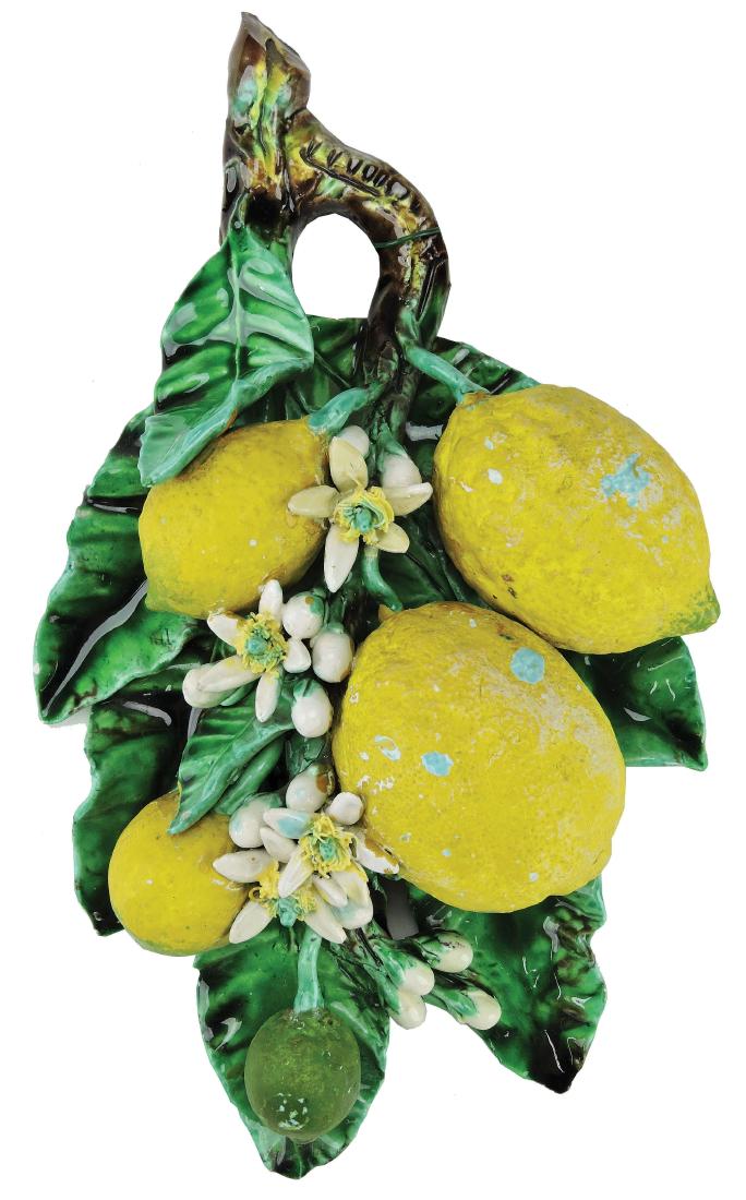 Menton Majolica Lemons Wall Applique c.1890,: modeled as four lemons and blossom against a green leaf backplate, 12 1/2". Curated and catalogued by Nicolaus Boston