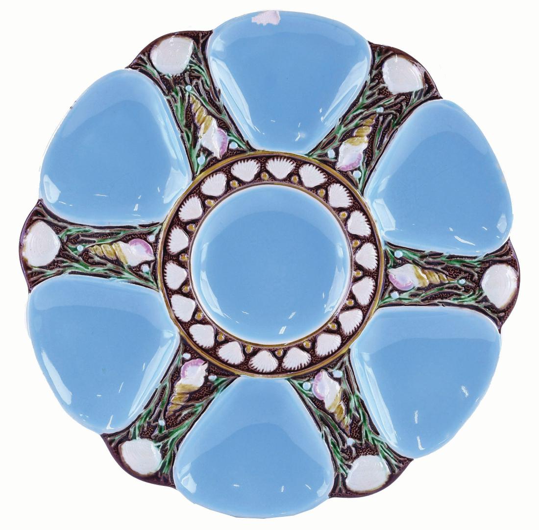 Minton Majolica Six Well Turquoise Oyster Plate: c.1875 modeled as a circular plate with turquoise wells separated by shells and seaweed, the green circular central well surrounded by conch shells, 9". Curated and catalogued by Nicolaus Boston