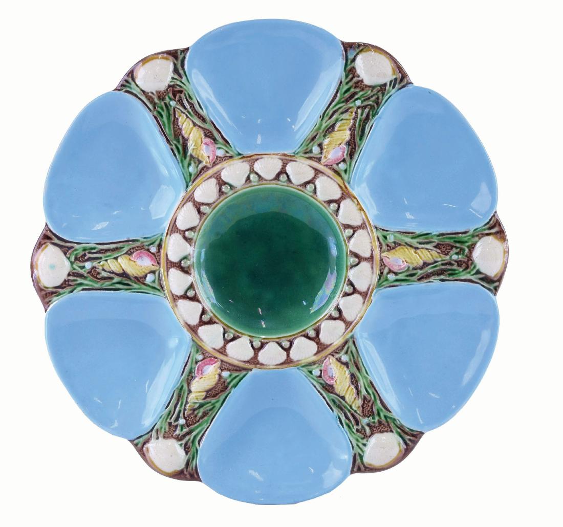 Minton Majolica Six Well Turquoise Oyster Plate: c.1875 modeled as a circular plate with turquoise wells separated by shells and seaweed, the green circular central well surrounded by conch shells, 9". Donna & David Reis Collection Curated and catal
