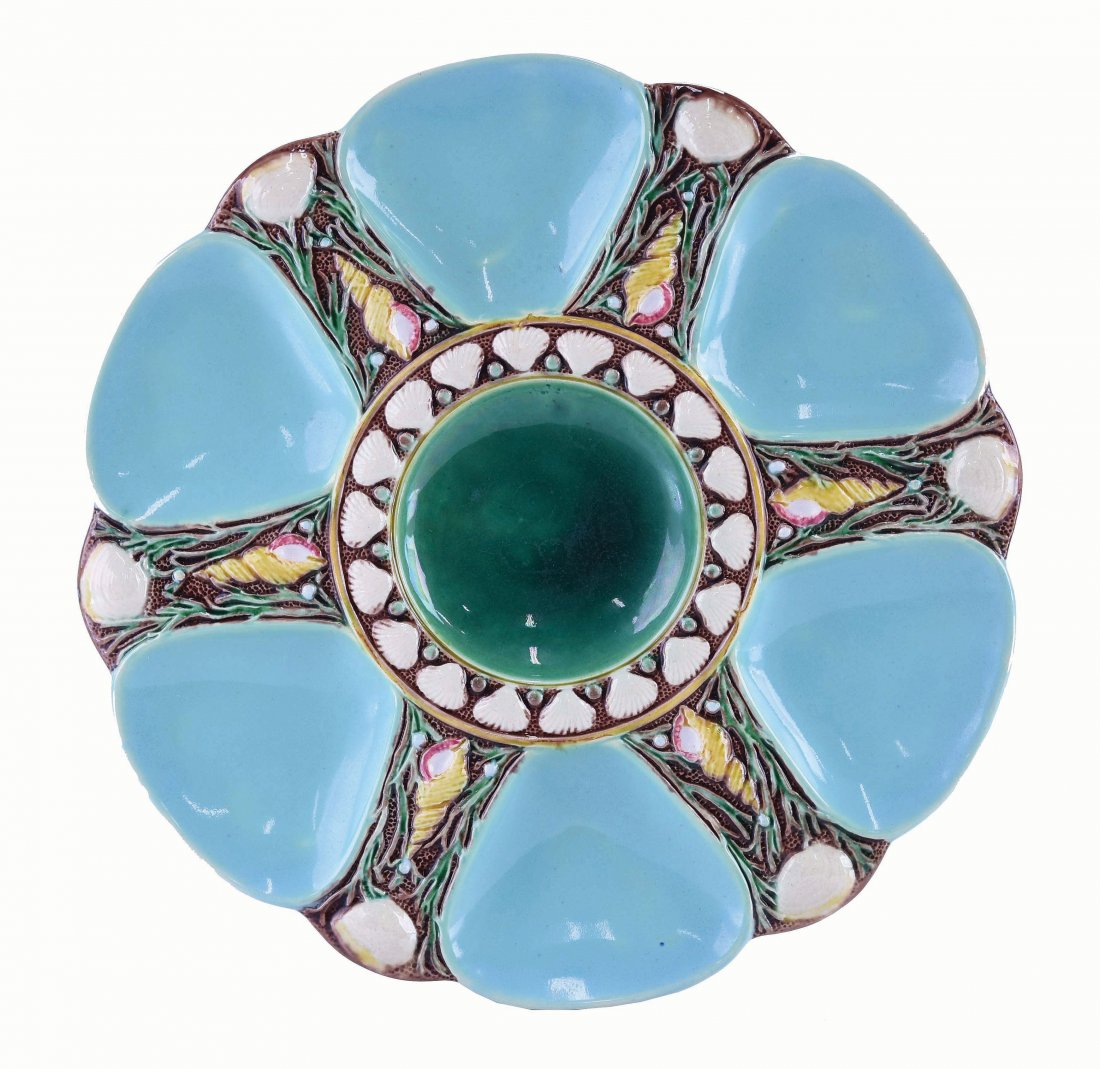 Minton Majolica Six Well Celadon Oyster Plate: c.1875 modeled as a circular plate with celadon wells separated by shells and seaweed, the green circular central well surrounded by conch shells, 9". Curated and catalogued by Nicolaus Boston