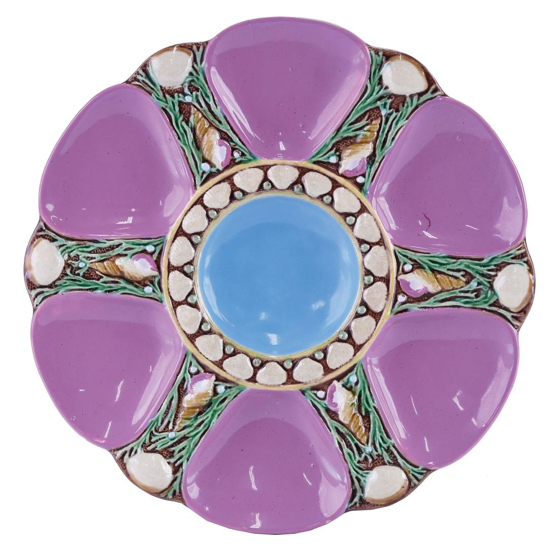Minton Majolica Six Well Pink Oyster Plate c.1875: modeled as a circular plate with pink wells separated by shells and seaweed, the turquoise circular central well surrounded by conch shells, 9". Curated and catalogued by Nicolaus Boston