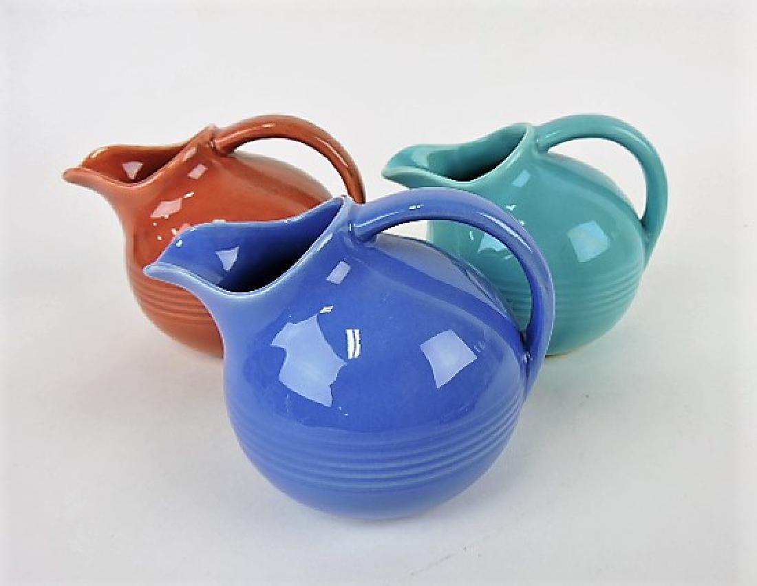 Harlequin novelty creamer group: mauve: blue, turquoise, rose (glaze imperfection)