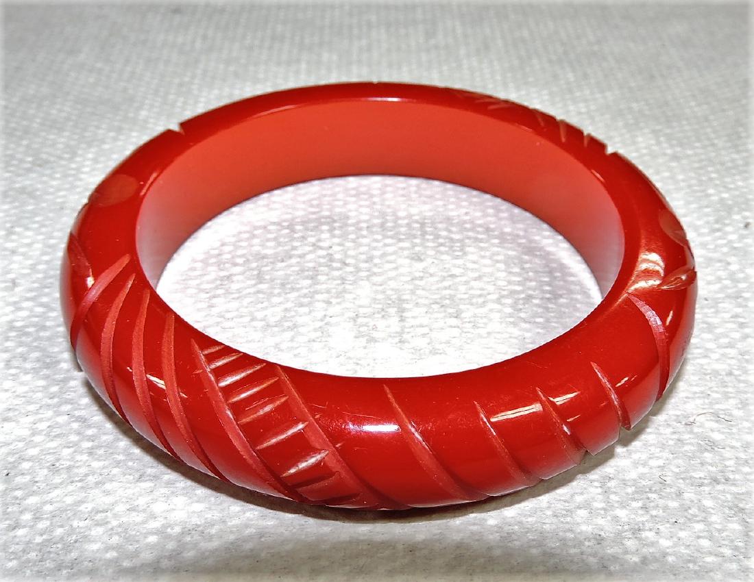 Red Bakelite carved bangle: bracelet