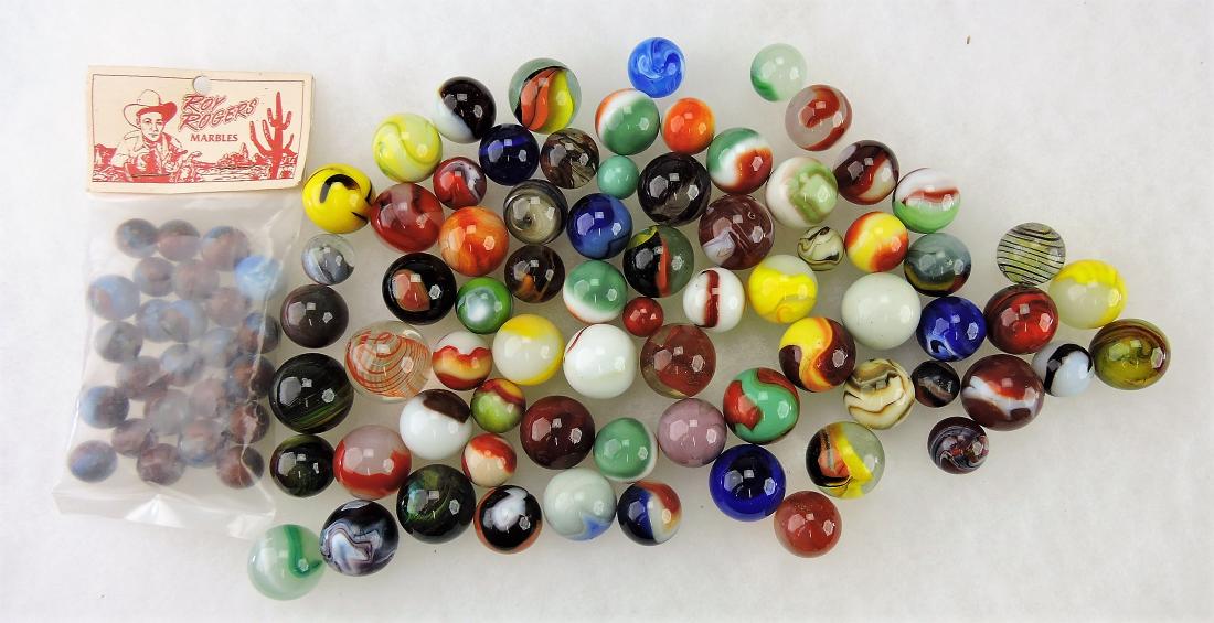 Lot of assorted marbles with: marble shooter