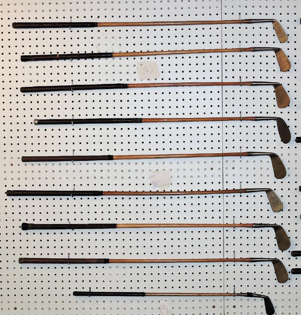 Wooden shaft golf club lot of 9 clubs;: Forged Open Hearth, Derby; Thomas & Wilson Co, hand forged, Bob McDonald, distance 160-180; Forged Westword H O, Mashie; Carnustie hammer forged; Junior mid iron hand forged, Mashie Niblick; Hand forg