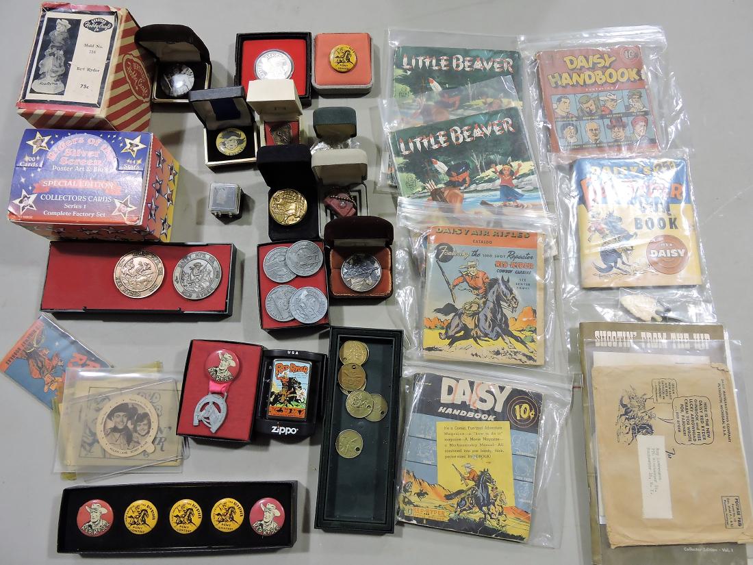 Daisy Red Ryder lot of gun books,: pin back buttons, medals, tokens, pendants, zippo lighter, and assorted premiums