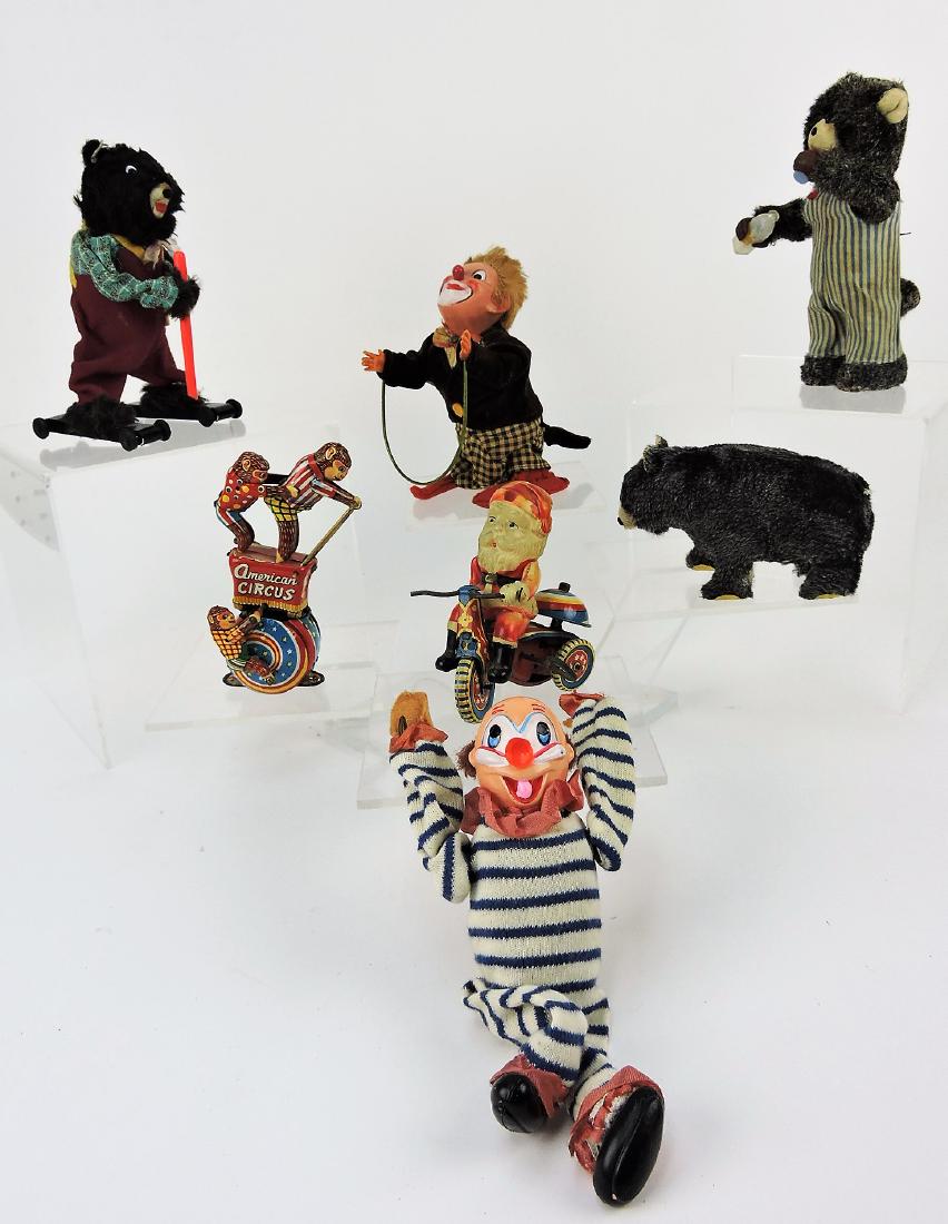 Wind up toy lot of 7: woodchuck skier,: American Circus with monkeys, Santa on tricycle, walking bear, bear with bottle of milk, jumping clown, crawling clown. All working
