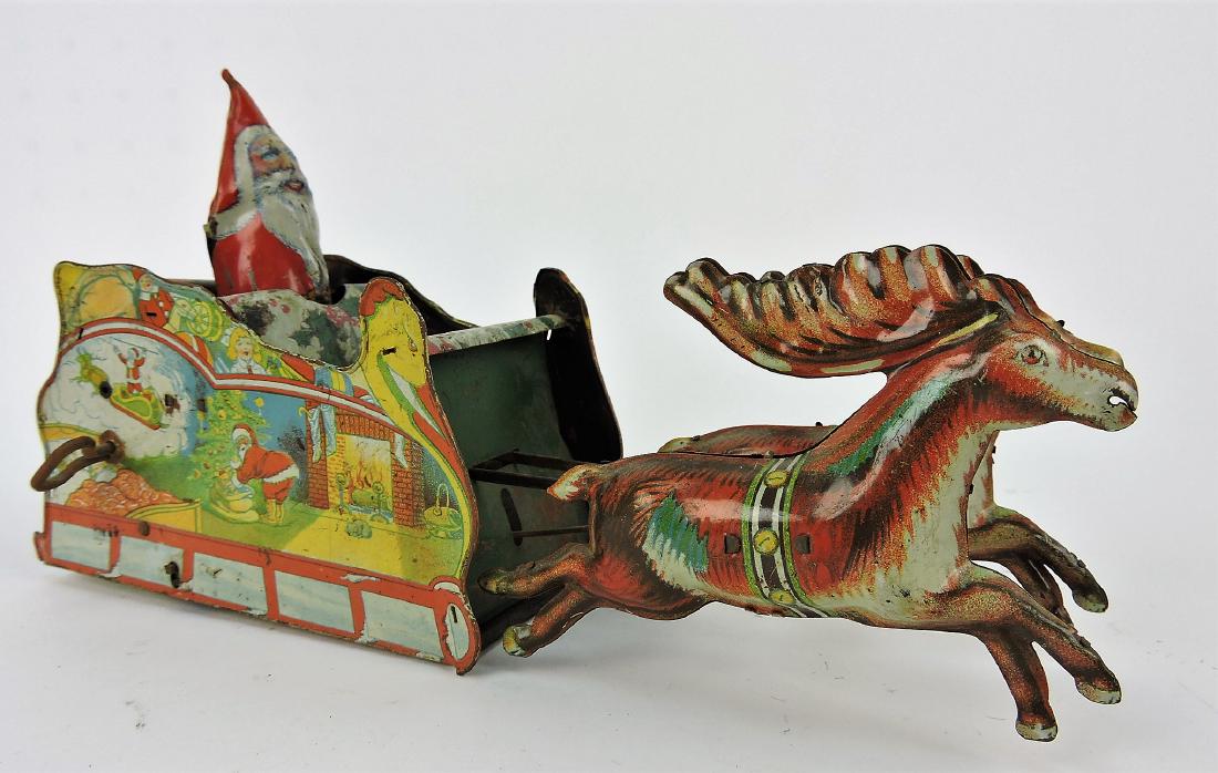 Strauss Santa Claus tin lithograph: wind up toy, 11", does not wind, missing Santa's arms