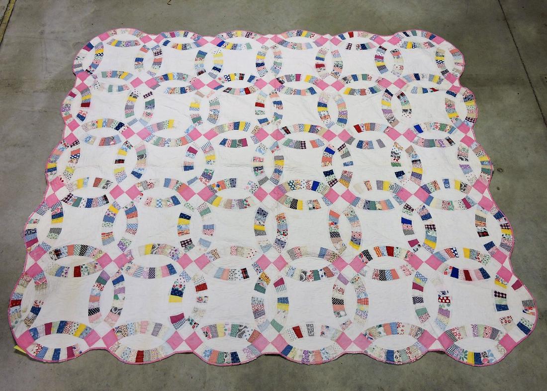 "Double Wedding Ring" quilt,: circa 1930, 70"x90", repairs needed
