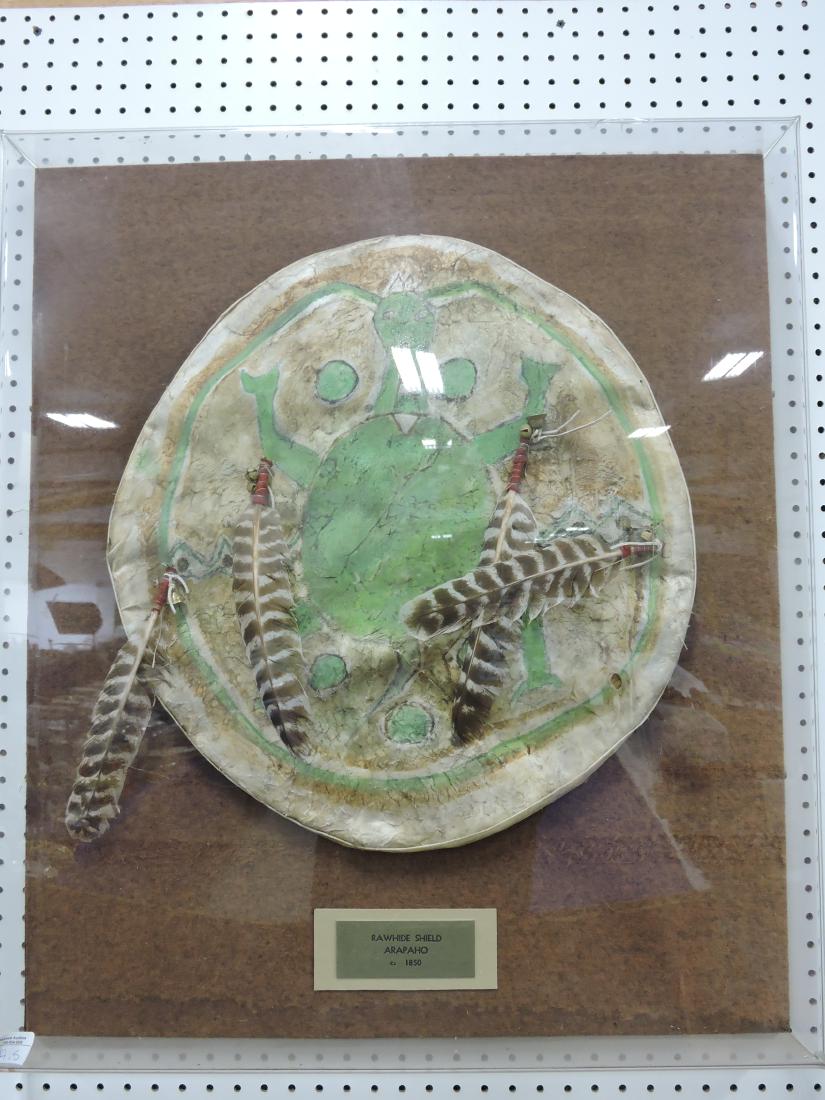Native American Indian Arapaho: rawhide shield in display case tag says circa 1850, 21"d