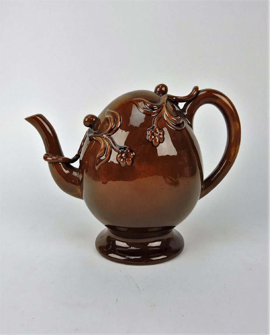 Majolica brown puzzle teapot, nick to: spout, 8"