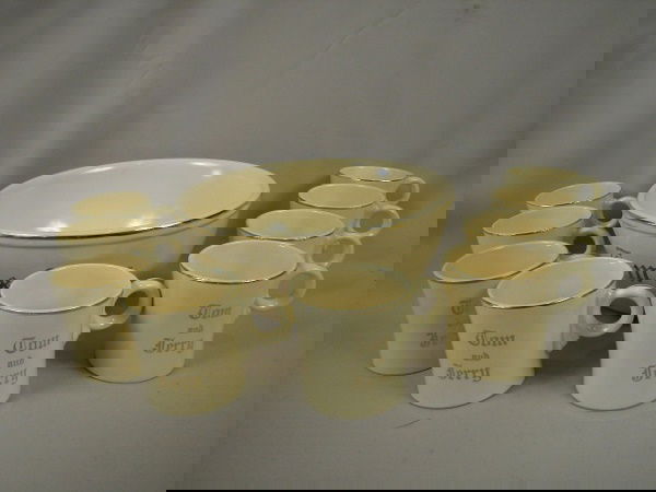 Fiesta Homer Laughlin Tom and Jerry punch set with: Fiesta Homer Laughlin Tom and Jerry punch set with punch bowl and 9 ring handled cups, rim nick to 1 cup