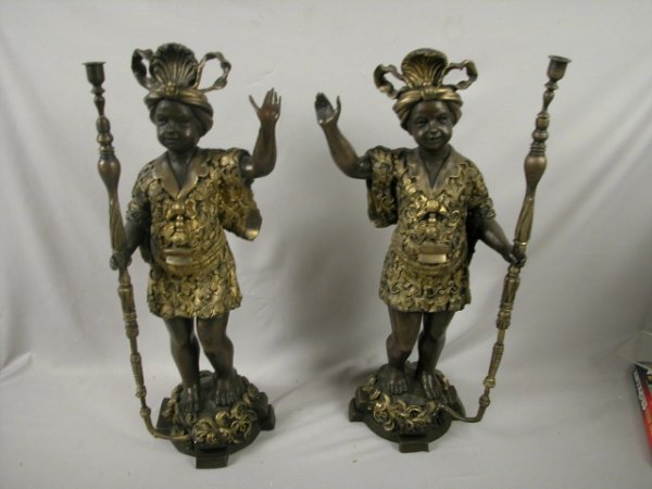 Pair of bronze blackamoor torcheres with gold gi